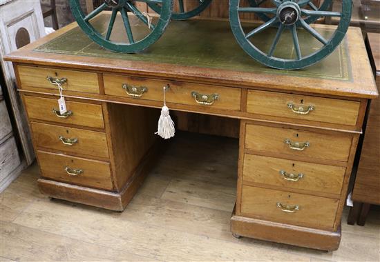 An Edwardian walnut pedestal desk w.145cm